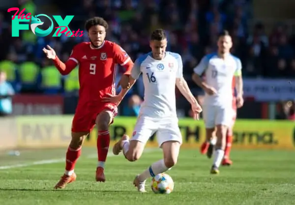 CARDIFF, WALES - Sunday, March 24, 2019: Wales' Tyler Roberts (L) challenges for the ball against Slovakia's Dávid Hancko (R) during the opening UEFA Euro 2020 Qualifying Group E match between Wales and Slovakia at the Cardiff City Stadium. (Pic by Gareth Davies/Propaganda)