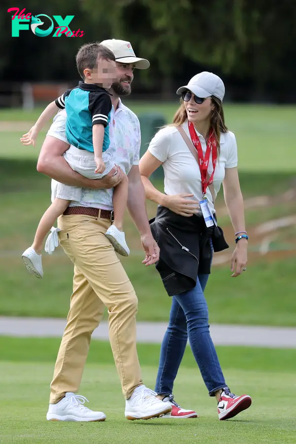 Justin Timberlake and Jessica Biel walking with their son