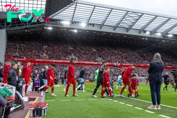 LIVERPOOL, ENGLAND - Sunday, April 14, 2024: Liverpool's captain Virgil van Dijk leads his side out before during the FA Premier League match between Liverpool FC and Crystal Palace FC at Anfield. Crystal Palace won 1-0. (Photo by David Rawcliffe/Propaganda)