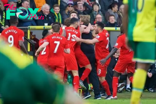 NORWICH, ENGLAND - Friday, January 22, 2016: Liverpool's Adam Lallana celebrates scoring the fifth, and winning, goal against Norwich City to seal a late 5-4 victory with manager Jürgen Klopp during the Premiership match at Carrow Road. (Pic by David Rawcliffe/Propaganda)