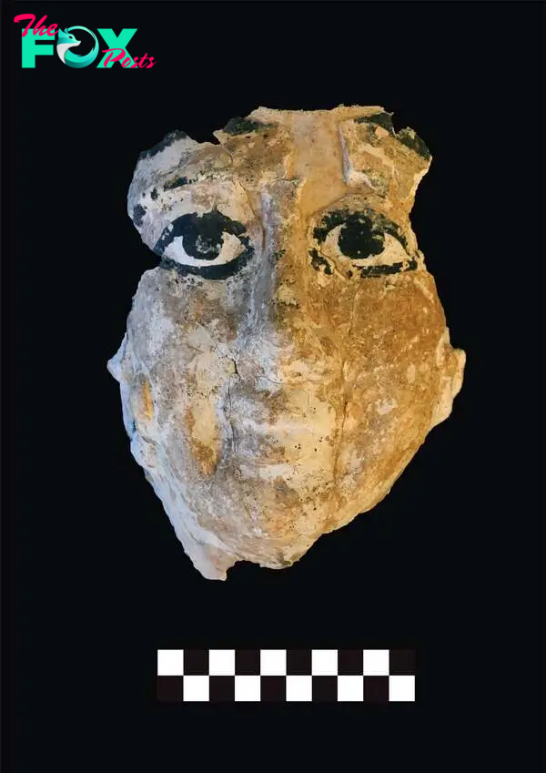 A coloured mask found at a burial site in Saqqara, Giza Governorate, Egypt.