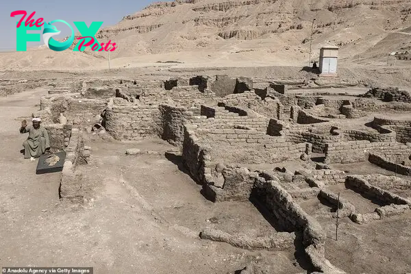 The walls of the ancient city have had sand and earth carefully removed from them to reveal the outline of the bricks