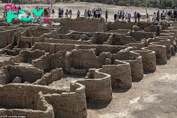 Today, the world was allowed a closer look at the stunning S-shaped walls which curve around the city's streets after archaeologists lauded how its intact structures were left standing 'as if it were yesterday'