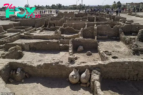 Crowds today gathered at the perimeter of the digging site to glimpse the ancient city, the greatest find since Tutankhamun's tomb a century ago