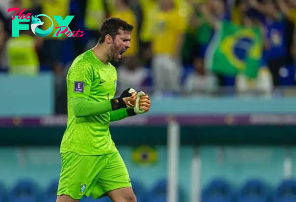 DOHA, QATAR - Monday, December 5, 2022: Brazil's goalkeeper Alisson Becker celebrates his side's second goal during the FIFA World Cup Qatar 2022 Round of 16 match between Brazil and South Korea at the Stadium 974. (Pic by David Rawcliffe/Propaganda)