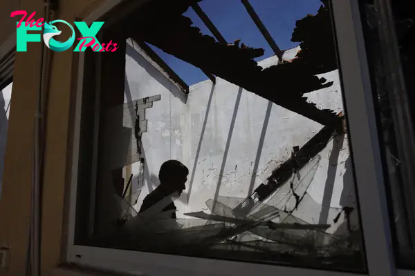 An Israeli soldier in a house damaged by an Hezbollah anti-tank missile near the Lebanon border in Kibbutz Hanita, northern Israel, on June 19.