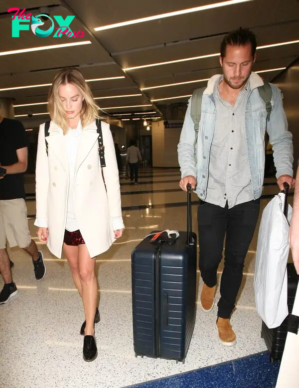 Margot Robbie and Tom Ackerley are seen at LAX on April 26, 2017.