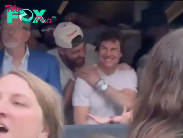 Travis Kelce and Tom Cruise at a concert.