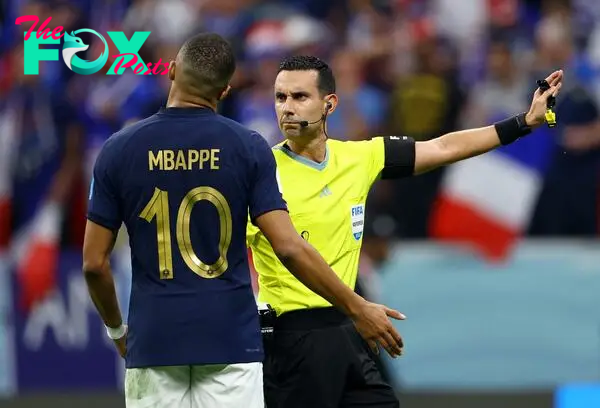 FIFA World Cup Qatar 2022 - Semi Final - France v Morocco
Referee Cesar Ramos signals to Kylian Mbappé.