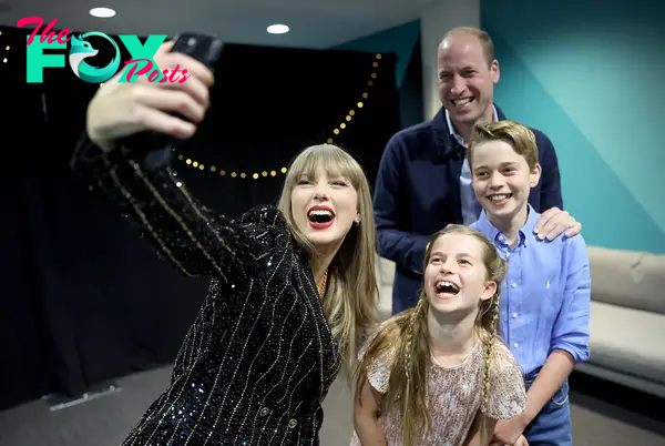 taylor swift taking a selfie with prince william, princess charlotte and prince george