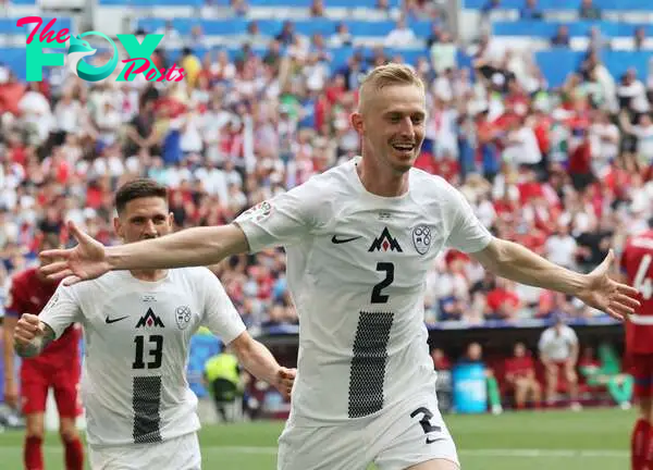 Munich (Germany), 20/06/2024.- Zan Karnicnik of Slovenia celebrates scoring the 1-0 opening goal during the UEFA EURO 2024 Group C soccer match between Slovenia and Serbia, in Munich, Germany, 20 June 2024. (Alemania, Eslovenia) EFE/EPA/MOHAMED MESSARA
