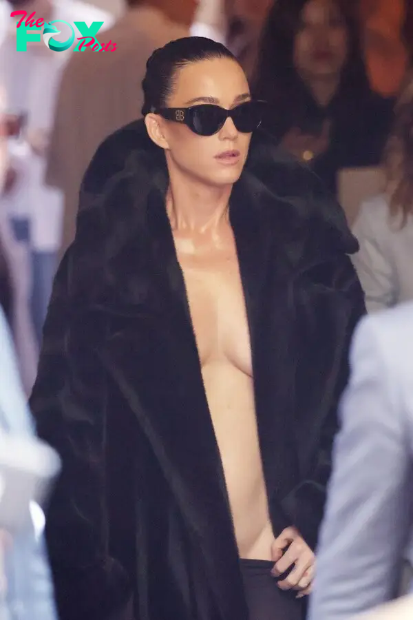 Katy Perry wearing a fur coat with no shirt at the Balenciaga Fall 2024 Couture show