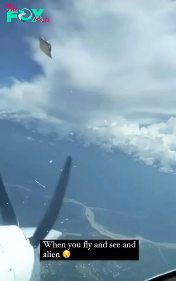 The moment the bizarre craft flies past the cockpit of an airplane
