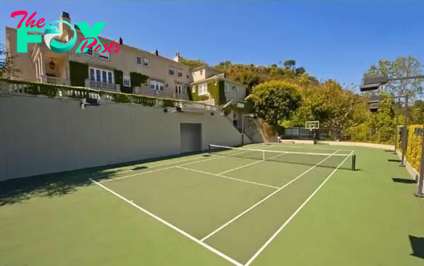 One of the мansion's features is a tennis court (pictured), according to the listing