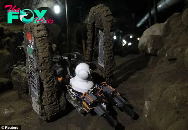 The remote control vehicle is equipped with a video cameras and a mechanical arm to clear obstacles out of its way as it maneuvers through the tight passageway