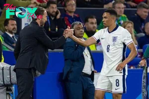 GELSENKIRCHEN, GERMANY - Sunday, June 16, 2024: England's Trent Alexander-Arnold (R) shakes hands with head coach Gareth Southgate as he walks to the bench as he is substituted during the UEFA Euro 2024 Group C match between Serbia and England at the Arena AufSchalke. (Photo by David Rawcliffe/Propaganda)