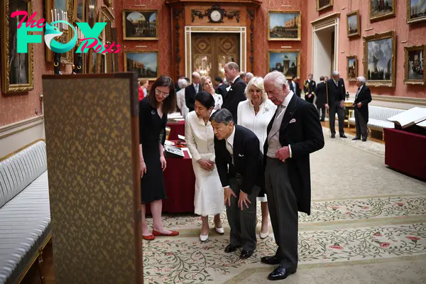 King Charles III walks with Japan's Emperor Naruhito, Queen Camilla and Japan's Empress Masako as they view a display of Japanese items from the Royal Collection in the Picture Gallery at Buckingham Palace on June 25.