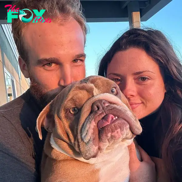 Morgan Eastwood and her husband with their dog