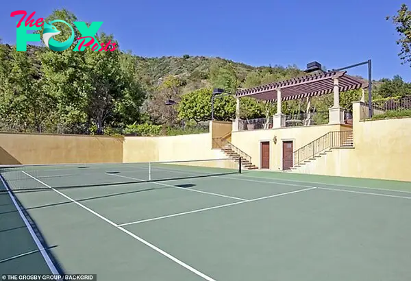 One loʋe: The property also includes a full size tennis court for anyone keen on practicing their serʋe