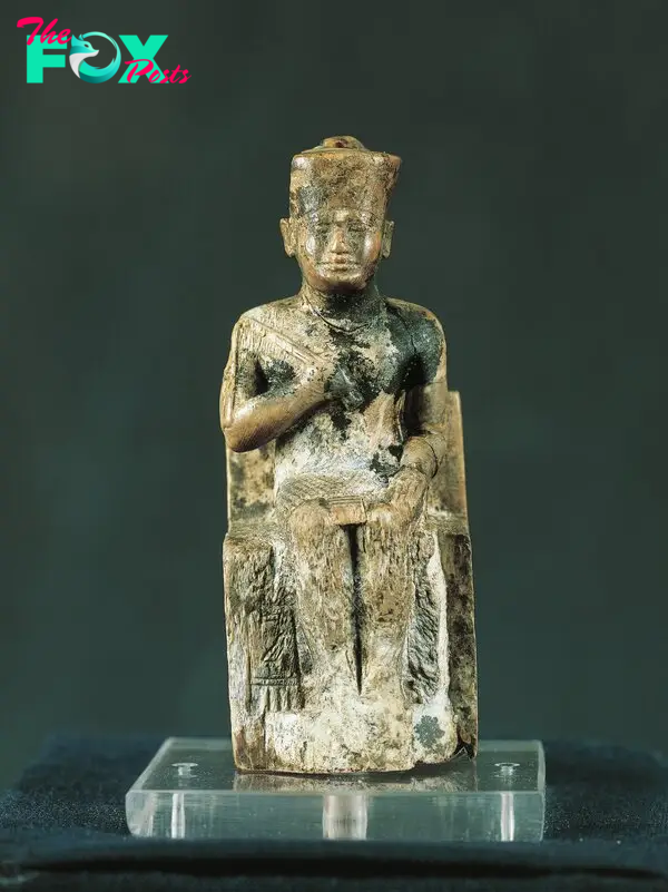  This is a statuette of Ancient Egyptian King Khufu, whose treasure may lurk below the Sphinx