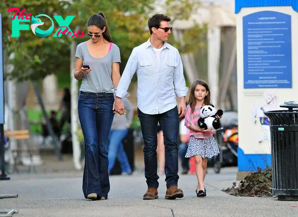 Suri Cruise with Tom Cruise and Katie Holmes in 2011. 