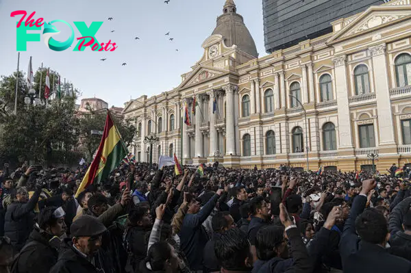 Demonstrators at Plaza Murillo, outside of Palacio Quemado in La Paz, Bolivia, on Wednesday, June 26, 2024. Chanting crowds lit fireworks and punched the air outside Bolivia's presidential palace as rebel soldiers dispersed after a failed coup attempt against the nation's socialist government.