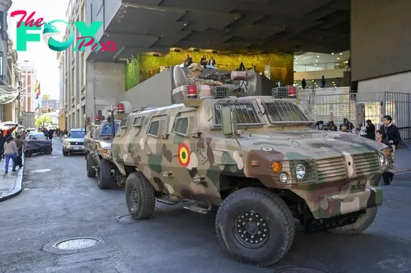 Military troops in armored vehicles are seen in the surroundings of Plaza Murillo in La Paz on June 26, 2024.