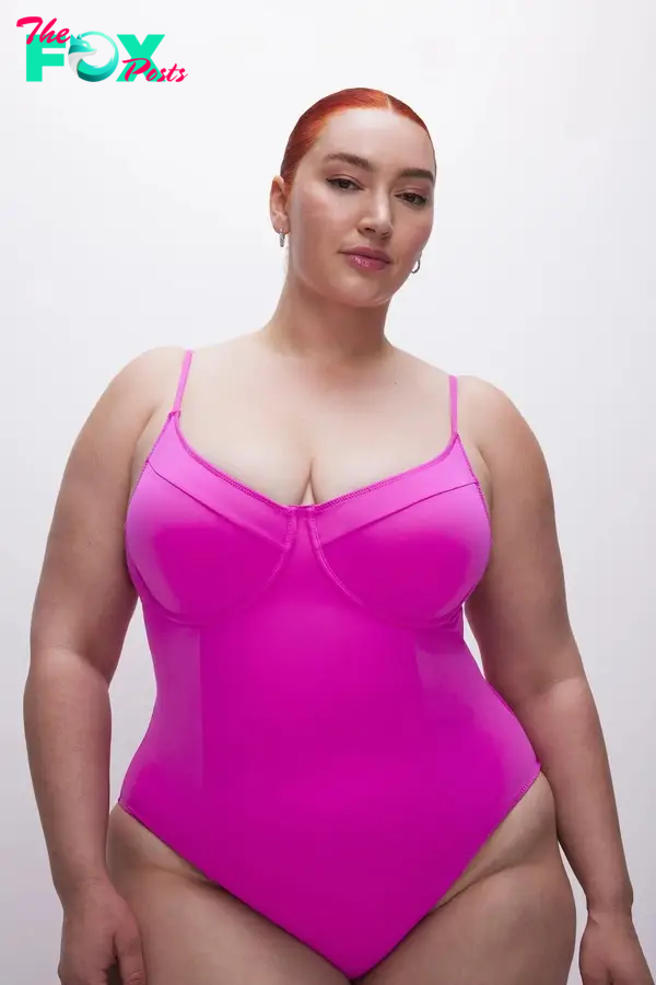 A model in a pink swimsuit
