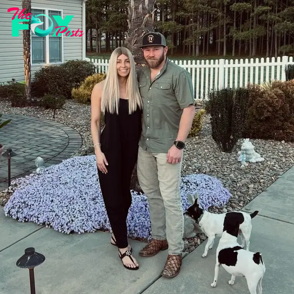 Lizzy Musi and Jeffrey Earnhardt with their dogs. 