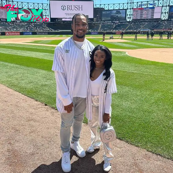 simone biles and husband jonathan owens standing on a baseball field