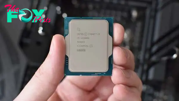 An Intel Core i5-14600K CPU being held in a hand.