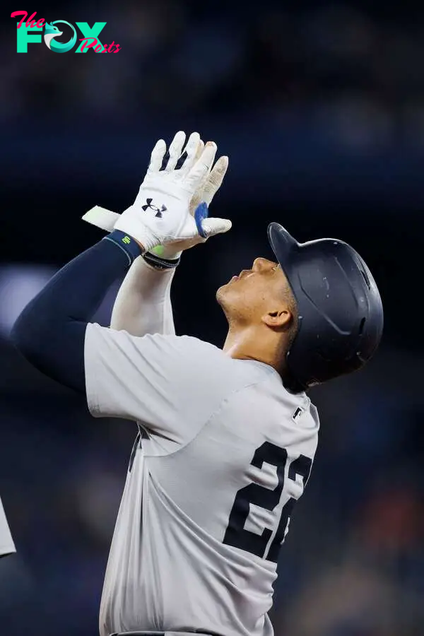TORONTO, CANADA - JUNE 28: Juan Soto #22 of the New York Yankees celebrates on base after hitting a single in the ninth inning of their MLB game against the Toronto Blue Jays at Rogers Centre on June 28, 2024 in Toronto, Ontario, Canada.   Cole Burston/Getty Images/AFP (Photo by Cole Burston / GETTY IMAGES NORTH AMERICA / Getty Images via AFP)
