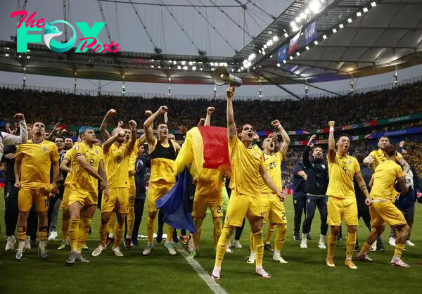 Romania celebrate their qualification for the Euro 2024 last 16.