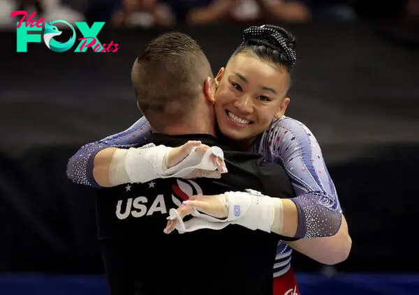 Leanne Wong hugs her coach after her uneven bars routine on Day Four of the 2024 U.S. Olympic Team Gymnastics Trials in Minneapolis on June 30, 2024.