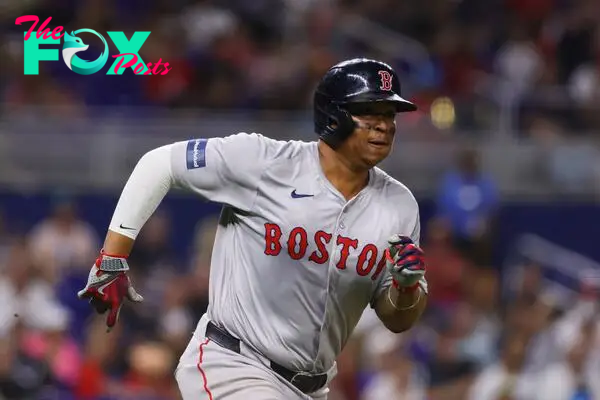 Jul 3, 2024; Miami, Florida, USA; Boston Red Sox third baseman Rafael Devers (11) runs toward third base after hitting an RBI triple against the Miami Marlins during the ninth inning at loanDepot Park. Mandatory Credit: Sam Navarro-USA TODAY Sports