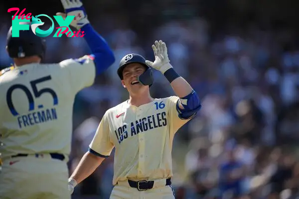 Jul 6, 2024; Los Angeles, California, USA; Los Angeles Dodgers catcher Will Smith (16) celebrates with first baseman Freddie Freeman (5) after hitting a two-run home run in the first inning against the Milwaukee Brewers at Dodger Stadium. Mandatory Credit: Kirby Lee-USA TODAY Sports