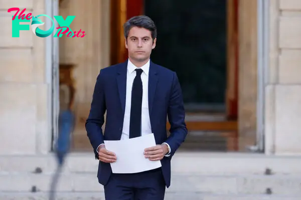 France's Prime Minister Gabriel Attal arrives to deliver a speech following the first results of the second round of France's legislative election at Matignon in Paris on July 7, 2024.