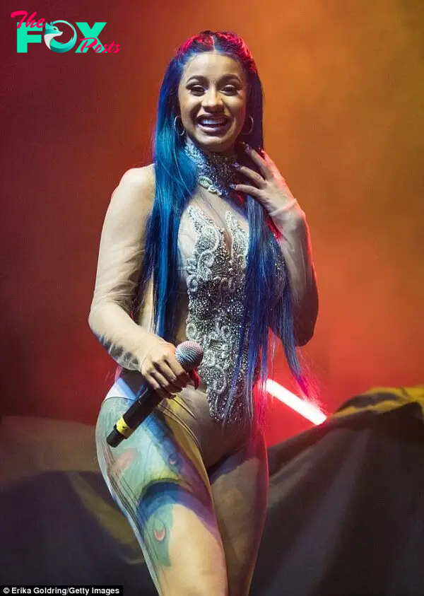 Cardi B twerks in nude sheer leotard and debuts blue locks | Daily Mail Online