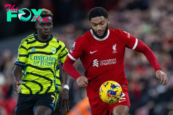 LIVERPOOL, ENGLAND - Saturday, December 23, 2023: Liverpool's Joe Gomez (R) and Arsenal's Bukayo Saka during the FA Premier League match between Liverpool FC and Arsenal FC at Anfield. (Photo by David Rawcliffe/Propaganda)