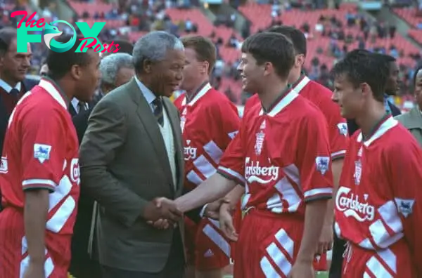 JOHANNESBURG, REPUBLIC OF SOUTH AFRICA - Sunday, May 29, 1994: Life-long Liverpool FC supporter and newly elected President of the Republic of South Africa Nelson Mandela meets the Liverpool players before the United Bank Soccer Festival friendly match at Ellis Park Stadium. John Barnes and Phil Charnock. (Pic by David Rawcliffe/Propaganda)