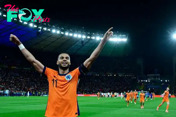 Netherlands' forward #11 Cody Gakpo celebrates after the UEFA Euro 2024 quarter-final football match between the Netherlands and Turkey at the Olympiastadion in Berlin on July 6, 2024. (Photo by JOHN MACDOUGALL / AFP)