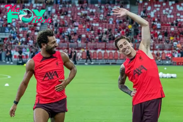 SINGAPORE - Thursday, July 14, 2022: Liverpool's Mohamed Salah (L) and Kostas Tsimikas during a training sessional at the National Stadium, Singapore ahead of the Standard Chartered Trophy pre-season friendly match against Crystal Palace. (Pic by David Rawcliffe/Propaganda)