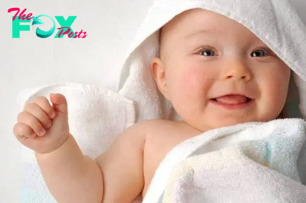 Download Baby Boy In White Towel Wallpaper | Wallpapers.com