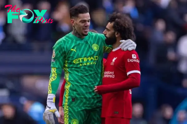 MANCHESTER, ENGLAND - Saturday, November 25, 2023: Manchester City's goalkeeper Ederson Santana de Moraes (L) and Liverpool's Mohamed Salah at the final whistle during the FA Premier League match between Manchester City FC and Liverpool FC at the City of Manchester Stadium. (Photo by David Rawcliffe/Propaganda)