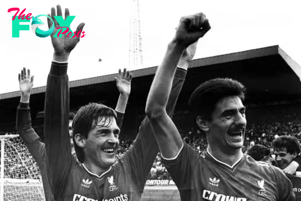 G4JKAR Liverpool player/manager Kenny Dalglish (left) and Ian Rush acknowledge their fans after they defeated Chelsea 1-0 at Stamford Bridge. Dalglish scored the winning goal in the 23rd minute, clinching. the First Division championship for Liverpool. 1986