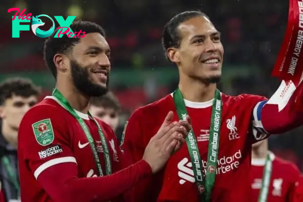 LONDON, ENGLAND - Sunday, February 25, 2024: Virgil van Dijk captain of Liverpool poses with the trophy with Ibrahim Konate and Joe Gomez after the Football League Cup Final match between Chelsea FC and Liverpool FC at Wembley Stadium. (Photo by Peter Powell/Propaganda)