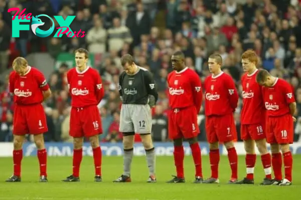 LIVERPOOL, ENGLAND - Saturday, January 10, 2004: Liverpool players stand for a moments silence in memory a club scout against Aston Villa during the Premiership match at Anfield. Igor Biscan, Sami Hyypia, Dietmar Hamman, goalkeeper Paul Jones, Emile Heskey, Harry Kewell, John Arne Riise, Michael Owen. (Photo by David Rawcliffe/Propaganda)