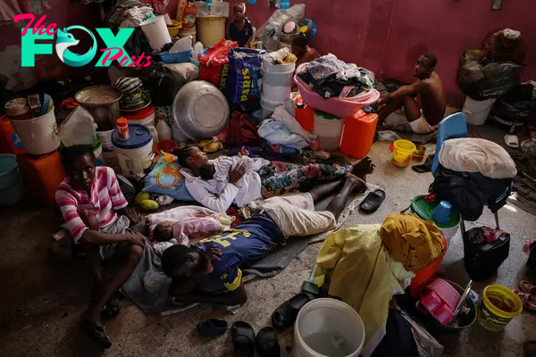 People displaced by gang war violence live inside a classroom at Darius Denis school, which transformed into a shelter where people live in poor conditions, in Port-au-Prince on May 5.