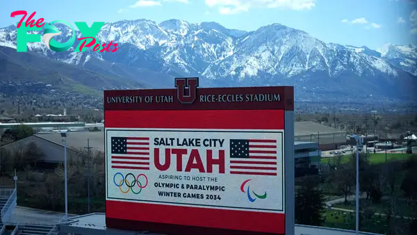 The scoreboard at the University of Utah’s Rice-Eccles Stadium promotes Salt Lake City’s bid to host another Winter Olympics in 2034 as International Olympic Committee members prepare to tour the stadium and other venues on April 10, 2024.
