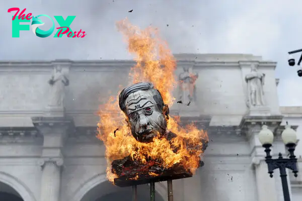 Activists burn an effigy of Israeli Prime Minister Benjamin Netanyahu during a pro-Palestinian protest near the U.S. Capitol in Washington, D.C., on July 24, 2024.